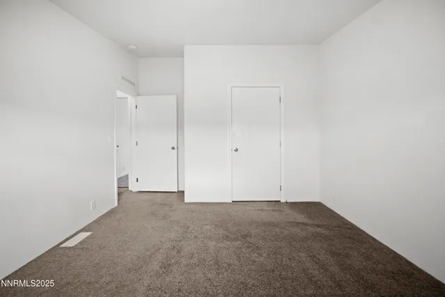 a view of living room with furniture and wooden floor