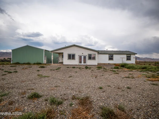 a view of house with a garden