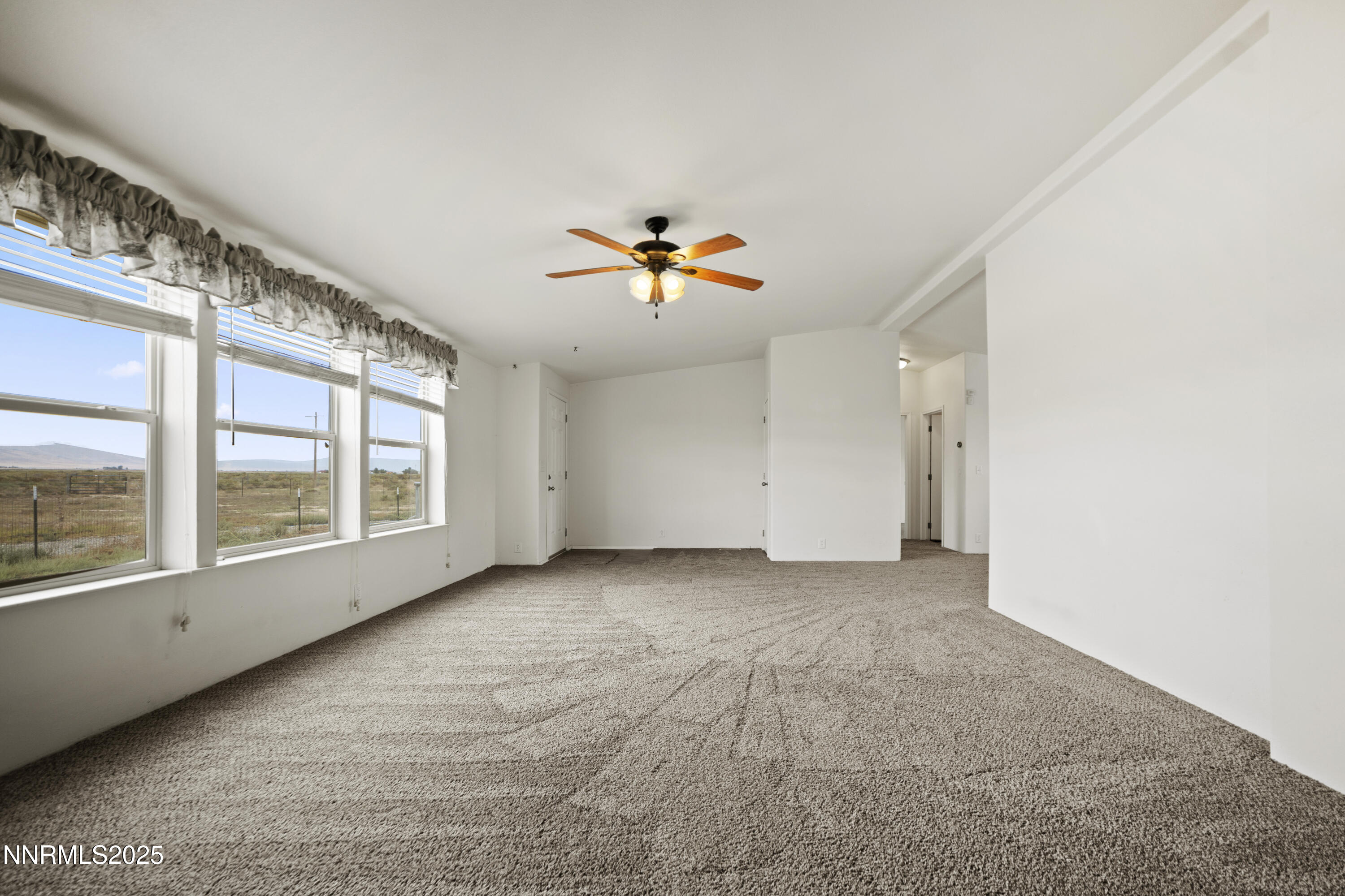 3900 Van Diest Road Winnemucca, NV 89445 - Photo 4 of 45 a view of an empty room with a window