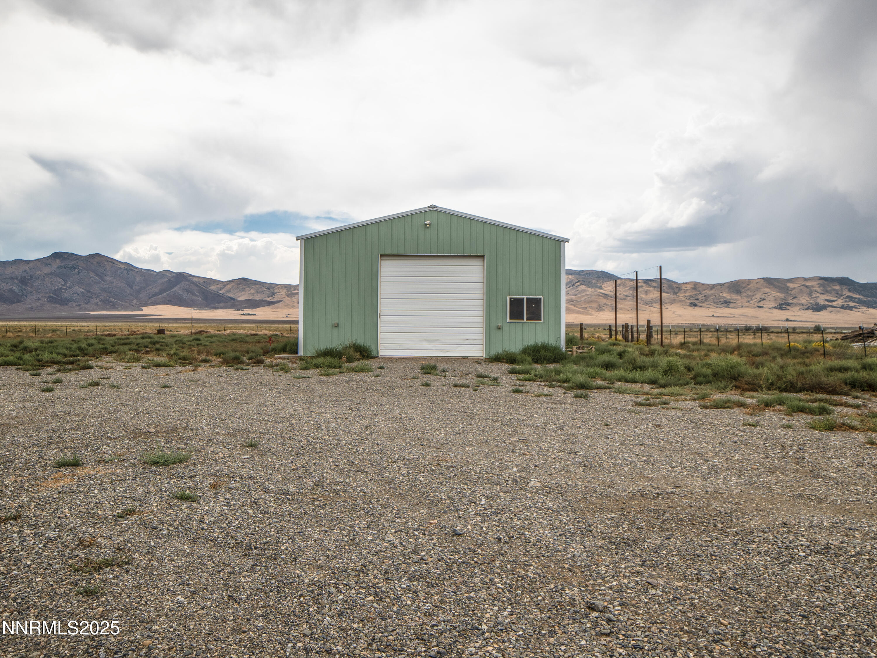 3900 Van Diest Road Winnemucca, NV 89445 - Photo 42 of 45 a view of a house with a yard and a large tree