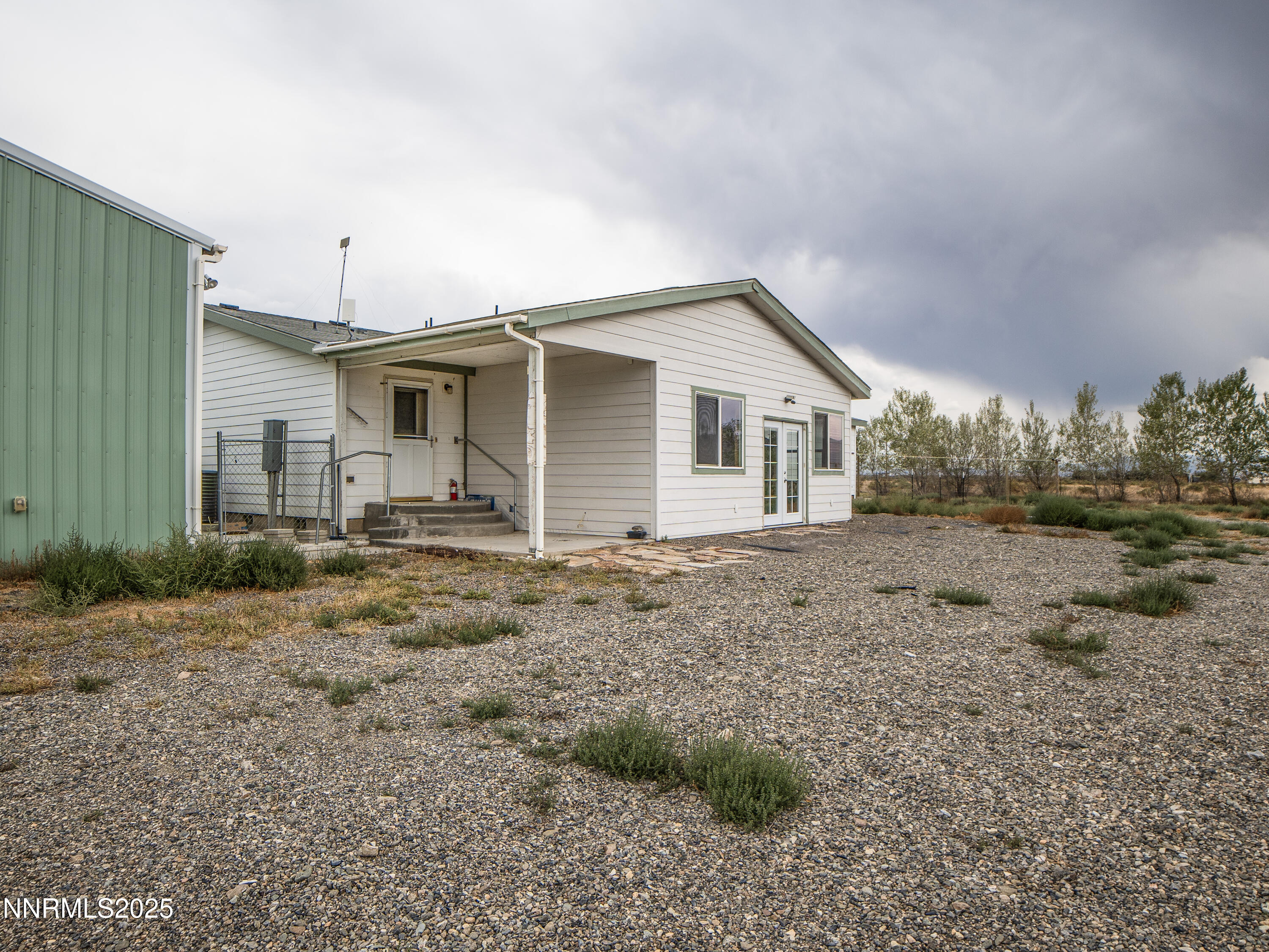 3900 Van Diest Road Winnemucca, NV 89445 - Photo 43 of 45 a view of a house with a backyard