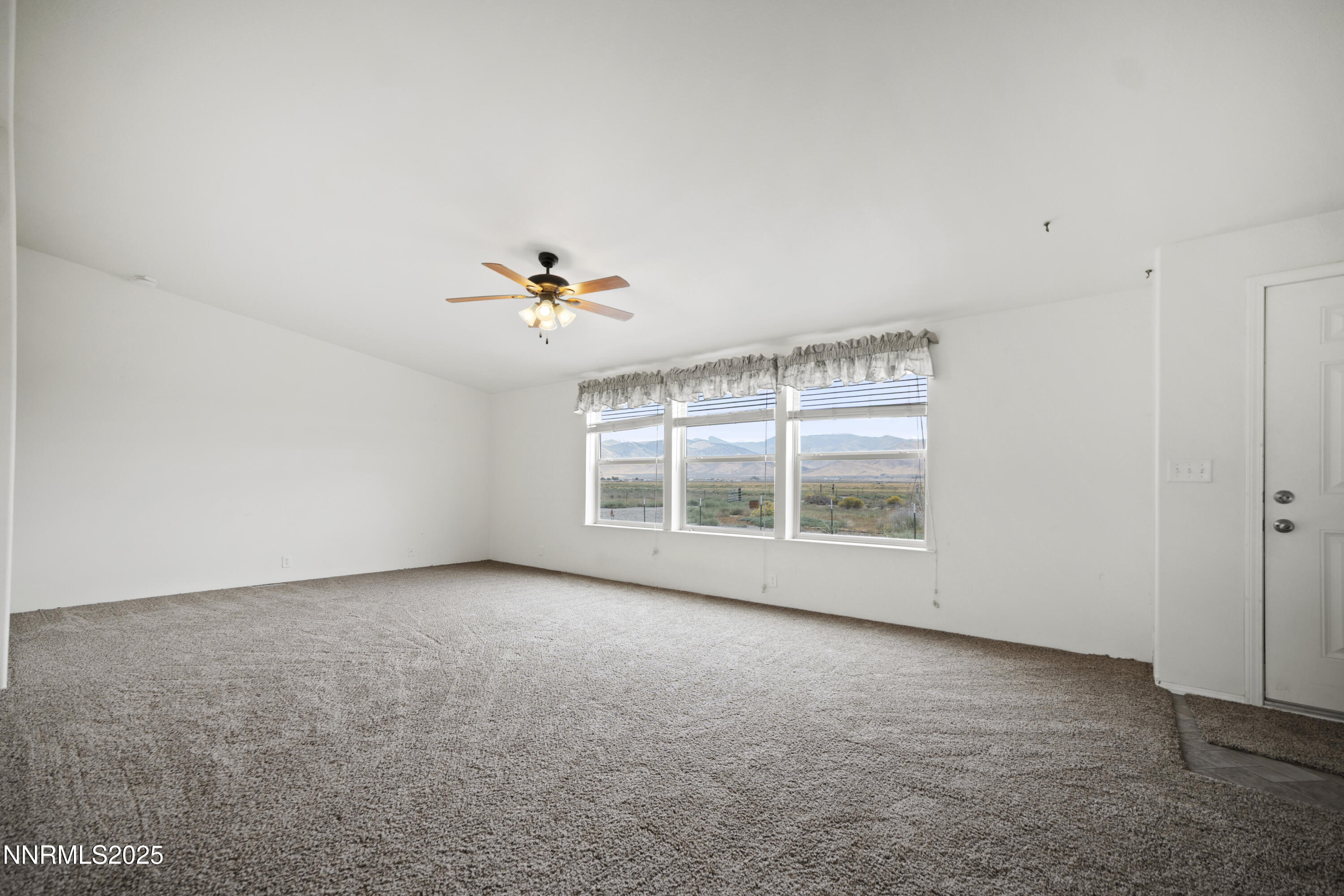 3900 Van Diest Road Winnemucca, NV 89445 - Photo 5 of 45 a view of an empty room with a window