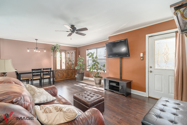 17643 Dundee Avenue Homewood, IL 60430 - Photo 2 of 27 a living room with furniture and wooden floor