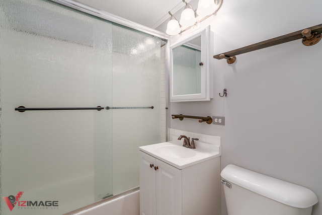 17643 Dundee Avenue Homewood, IL 60430 - Photo 14 of 27 a bathroom with a sink a toilet and shower
