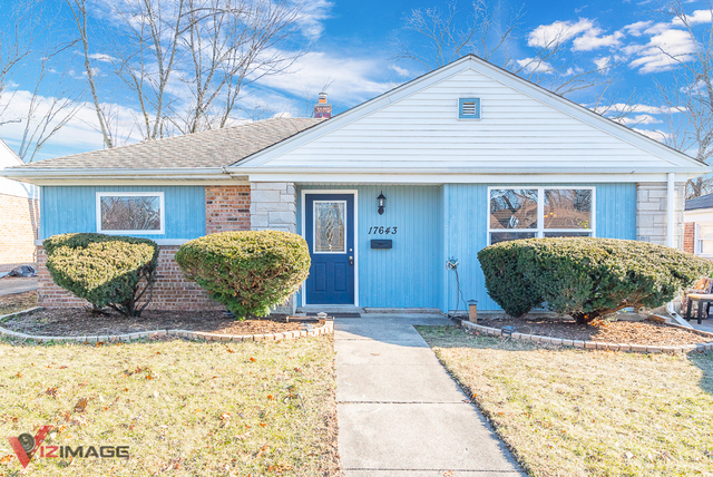 17643 Dundee Avenue Homewood, IL 60430 - Photo 18 of 27 a view of a house with a yard and potted plants