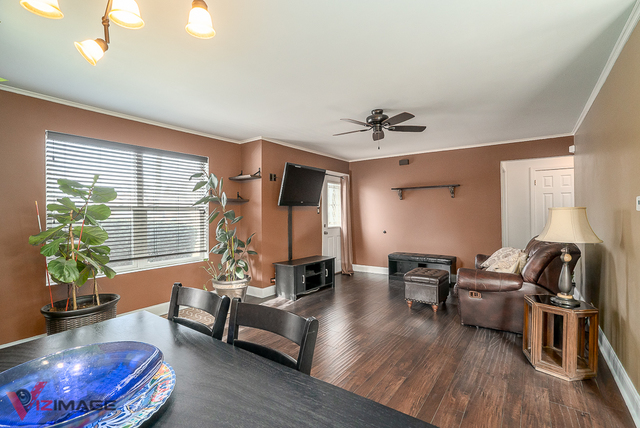 17643 Dundee Avenue Homewood, IL 60430 - Photo 3 of 27 a living room with furniture and a window
