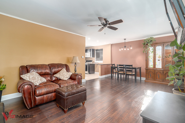 17643 Dundee Avenue Homewood, IL 60430 - Photo 4 of 27 a living room with furniture and wooden floor
