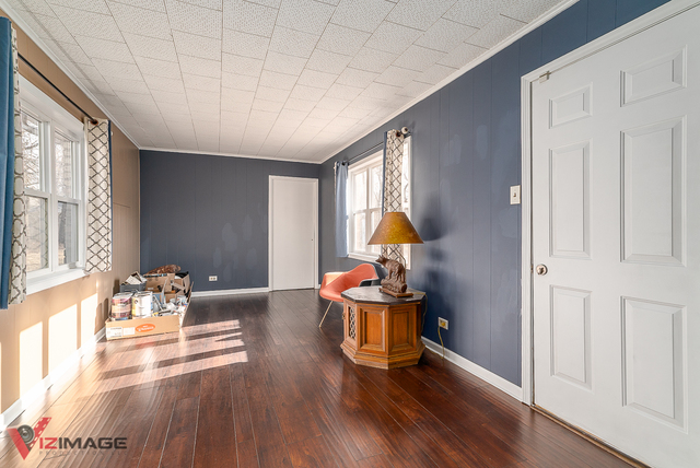 17643 Dundee Avenue Homewood, IL 60430 - Photo 10 of 27 a living room with furniture and a table