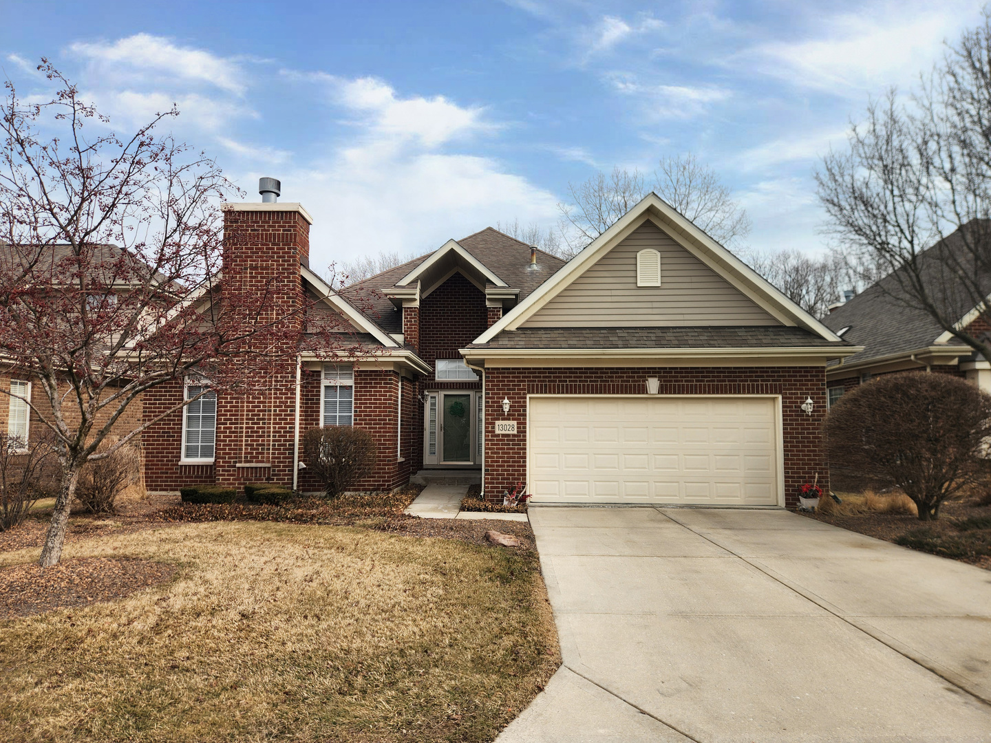 13028 Timber Trail Palos Heights, IL 60463 - Photo 2 of 6 a front view of a house with a yard and garage