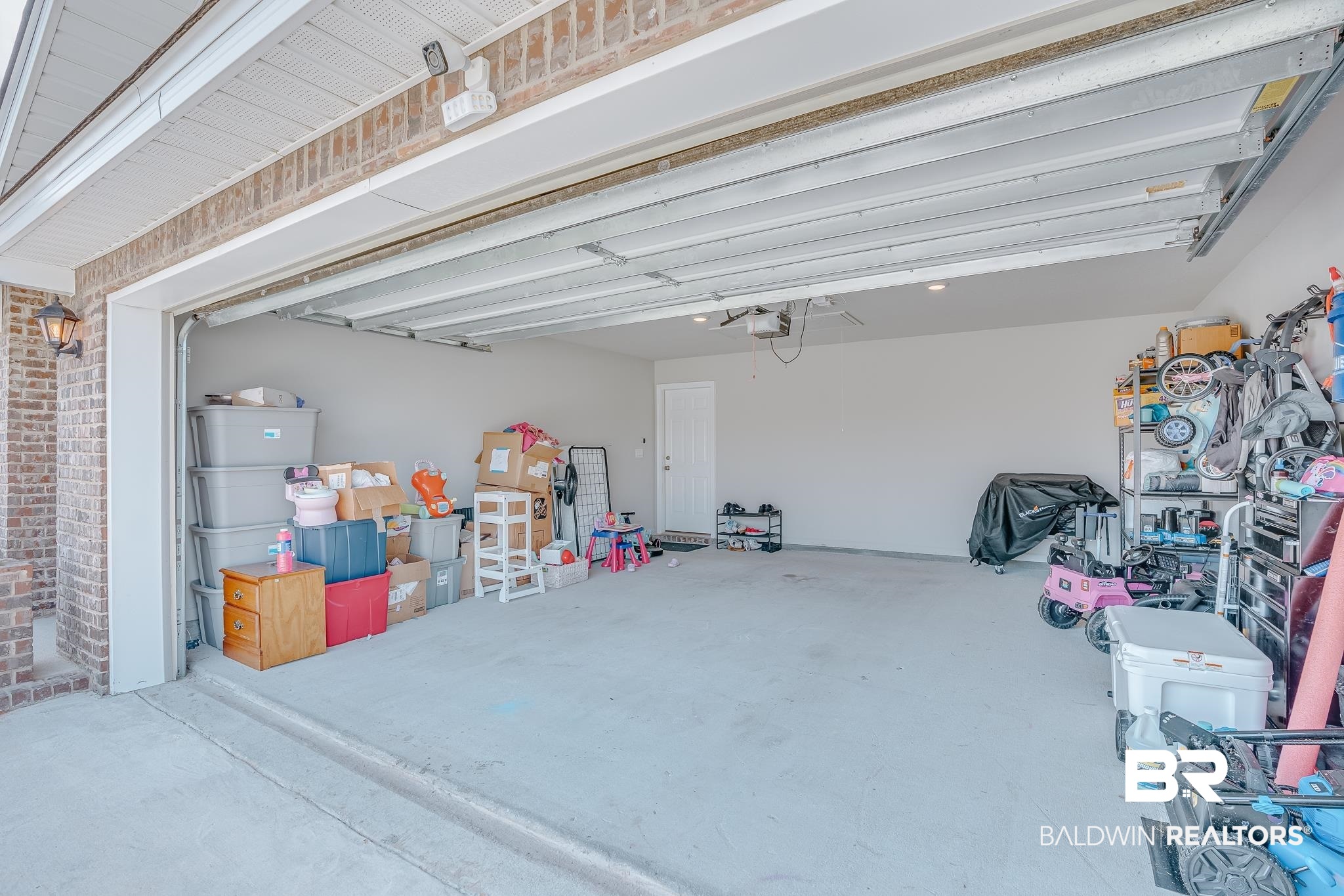 8242 Sycamore Way Semmes, AL 36575 - Photo 35 of 43 Garage with a garage door opener