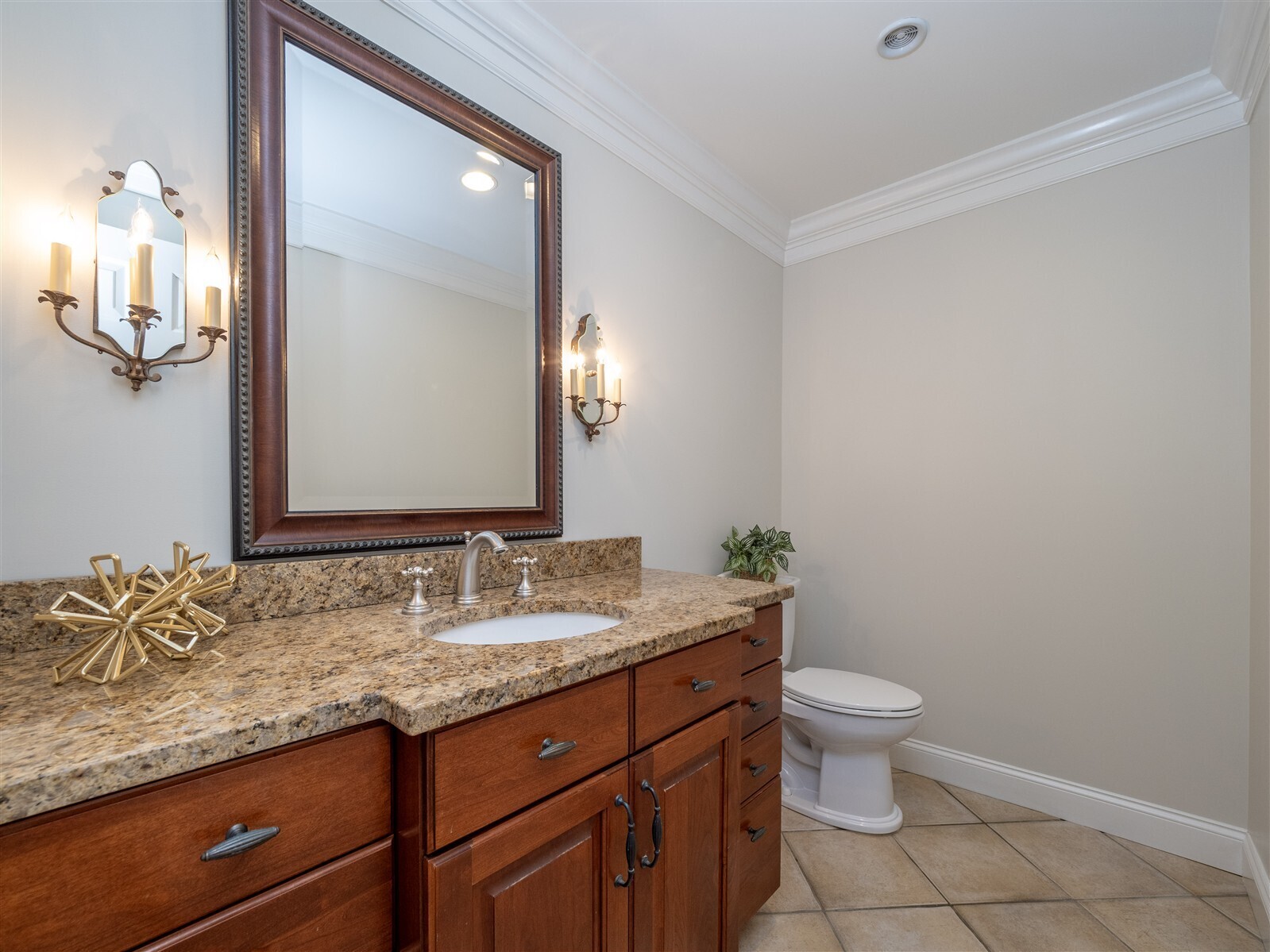 30 Wild Duck Road Wilton, CT 06897 - Photo 16 of 40 a bathroom with a granite countertop sink and a mirror