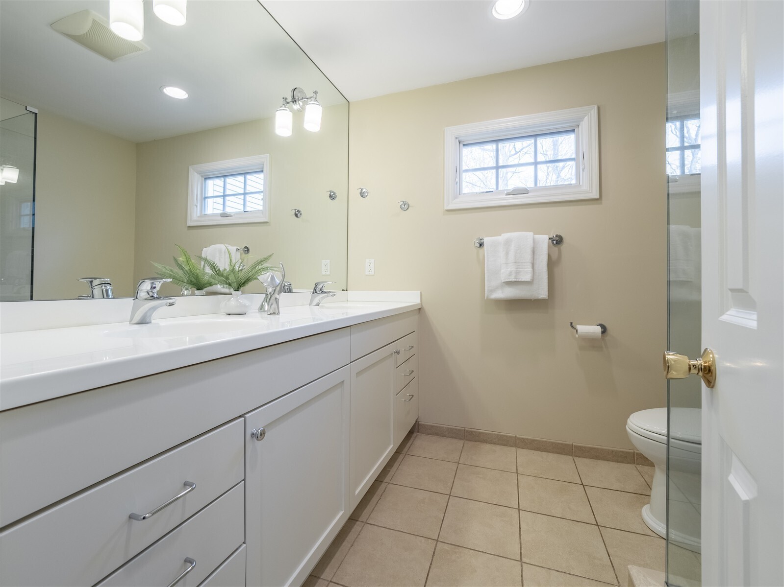 30 Wild Duck Road Wilton, CT 06897 - Photo 24 of 40 a bathroom with a sink a toilet and mirror