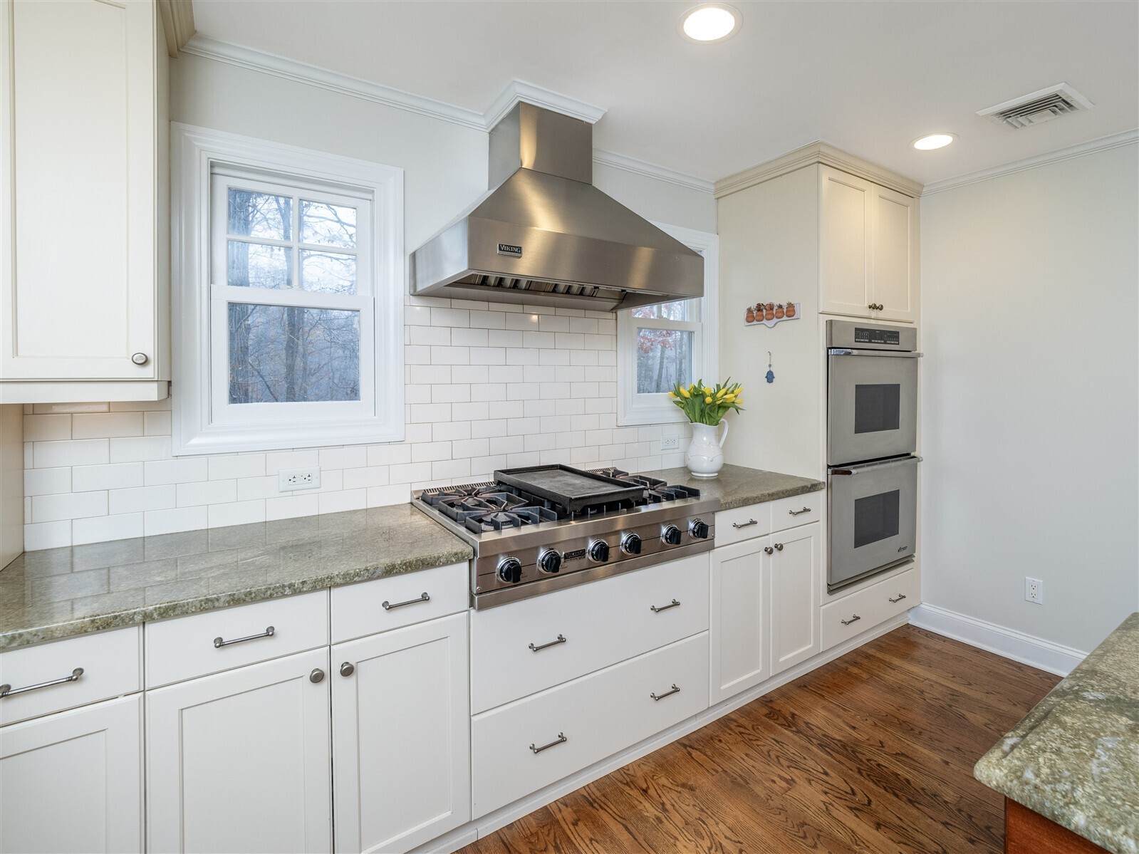 30 Wild Duck Road Wilton, CT 06897 - Photo 6 of 40 a kitchen with granite countertop white cabinets and stainless steel appliances