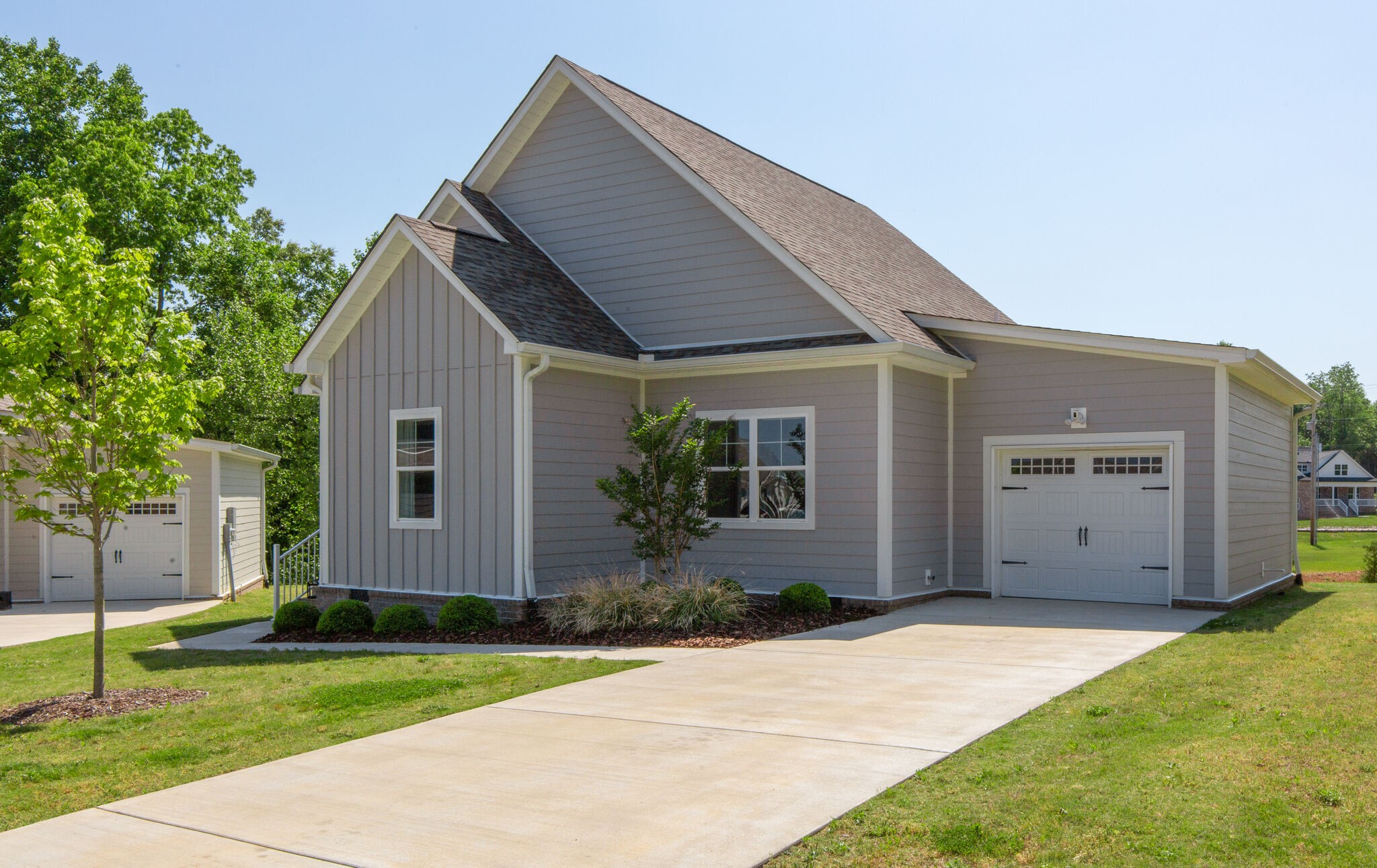 39 Sycamore Ridge West Burns, TN 37029 - Photo 2 of 22 a front view of house with yard and green space