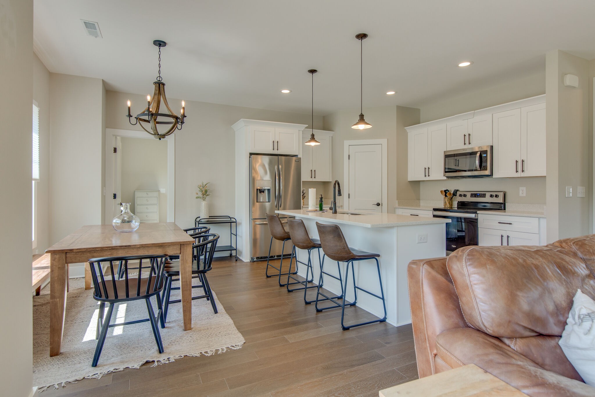 39 Sycamore Ridge West Burns, TN 37029 - Photo 7 of 22 a living room with kitchen island furniture and a chandelier