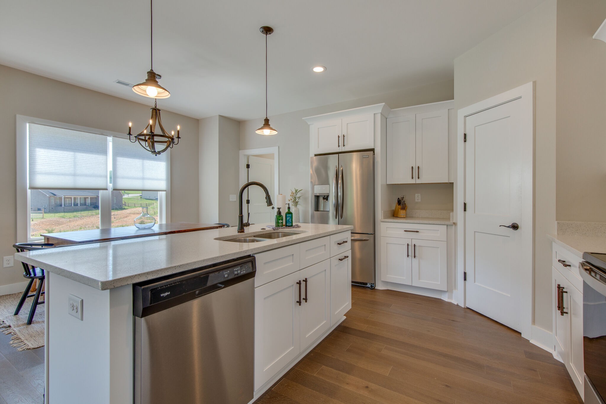 39 Sycamore Ridge West Burns, TN 37029 - Photo 9 of 22 a kitchen with stainless steel appliances a sink a stove a refrigerator and island with wooden floor
