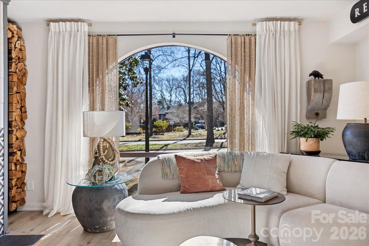 5801 Sharon Road, Unit J Charlotte, NC 28210 - Photo 12 of 46 a living room with furniture and a large window