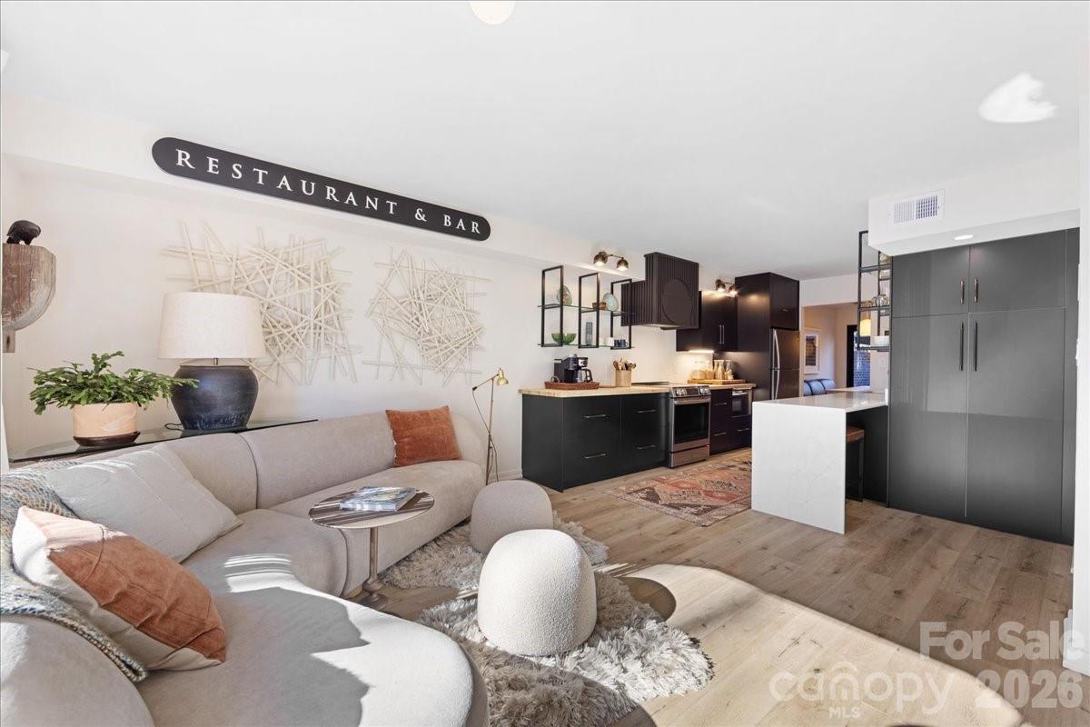 5801 Sharon Road, Unit J Charlotte, NC 28210 - Photo 14 of 46 a living room with furniture and a couch