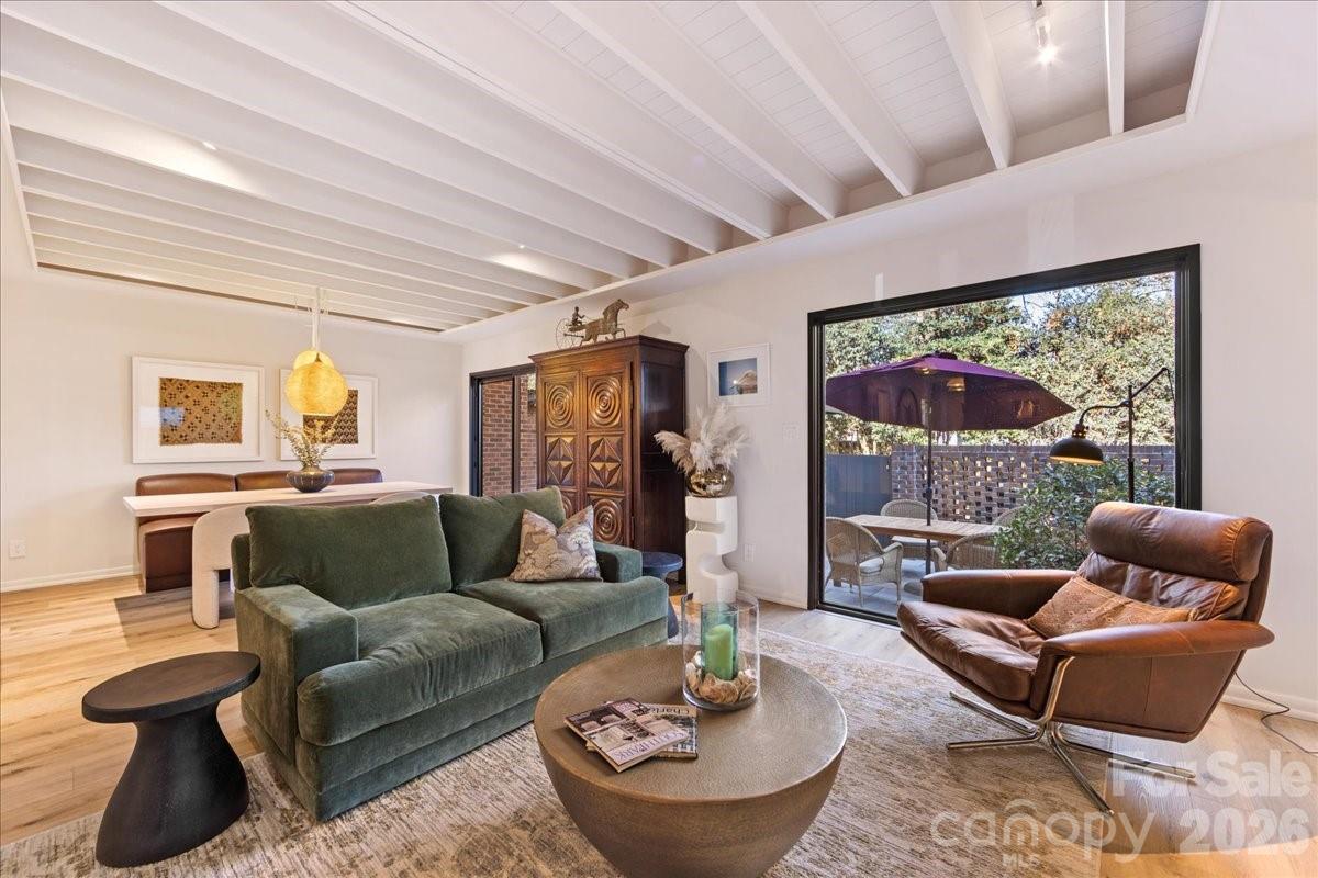 5801 Sharon Road, Unit J Charlotte, NC 28210 - Photo 15 of 46 a living room with furniture and a large window