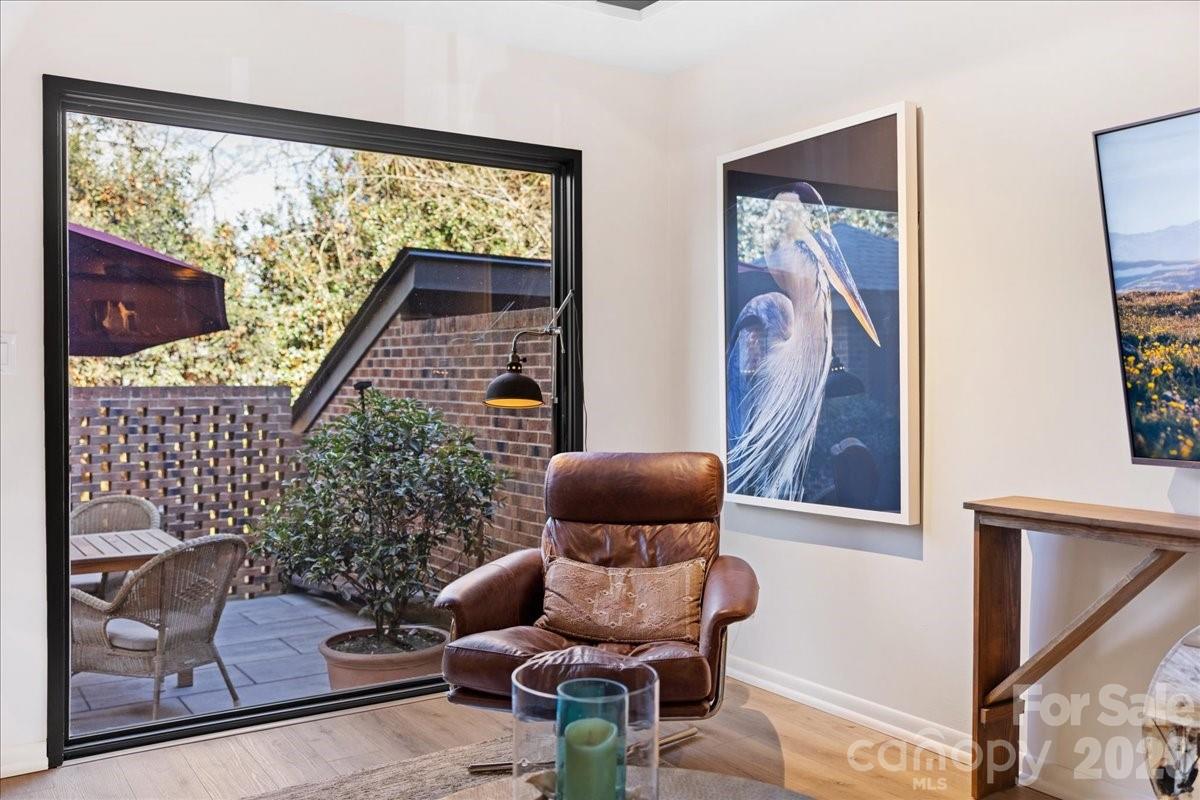 5801 Sharon Road, Unit J Charlotte, NC 28210 - Photo 17 of 46 a living room with furniture and a window