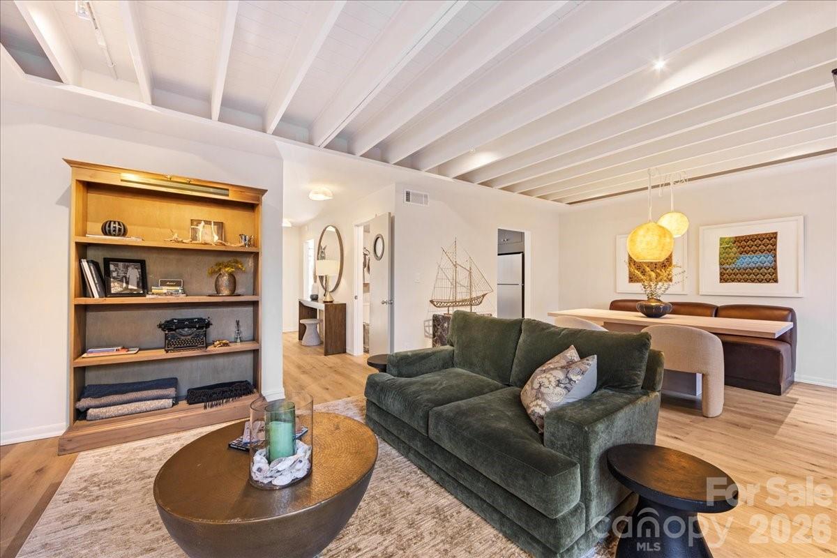 5801 Sharon Road, Unit J Charlotte, NC 28210 - Photo 18 of 46 a living room with furniture and a wooden floor