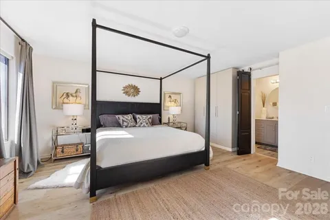 a bedroom with a large bed and a closet