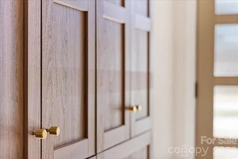 a bathroom with a glass shower door