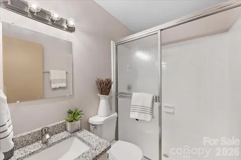 a view of an outdoor sitting area with furniture and umbrella