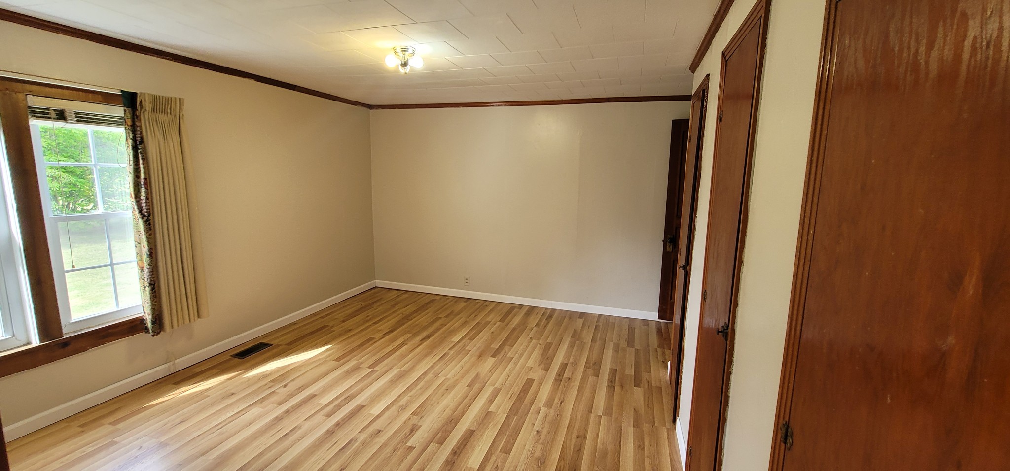 19 Turkey Scratch Road Spencer, TN 38585 - Photo 21 of 27 a view of empty room with wooden floor and fan