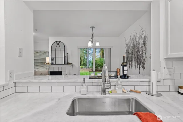 a kitchen with a sink and a window