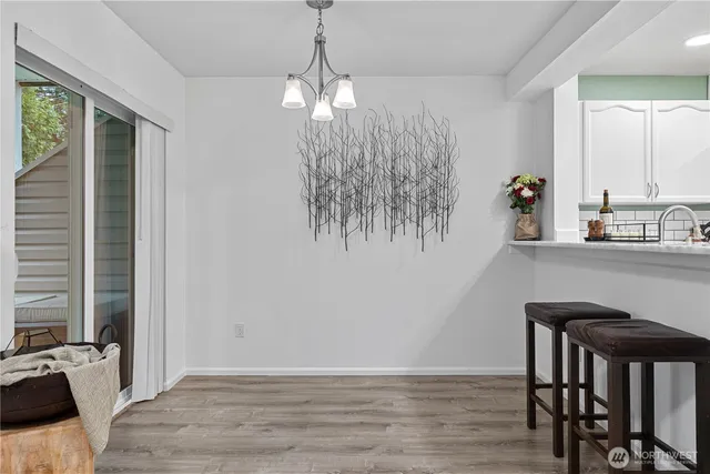 a view of a dining room with furniture and window