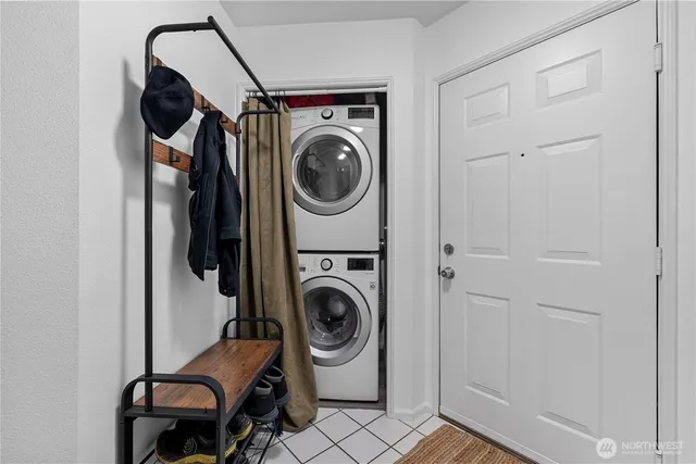 a utility room with sink dryer and washer