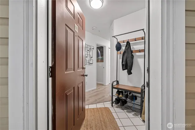 a hallway with dining area and glass doors
