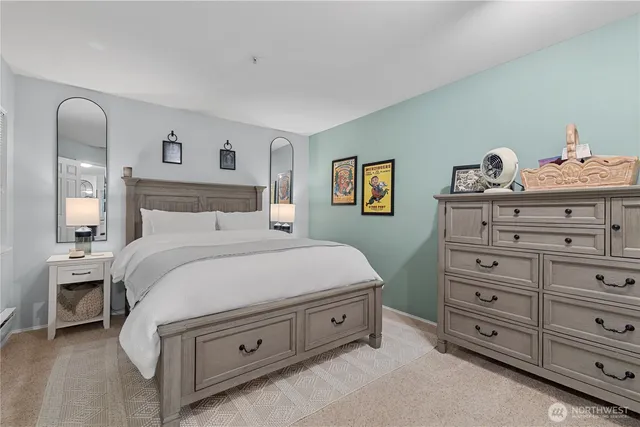 a bedroom with a bed and a dresser