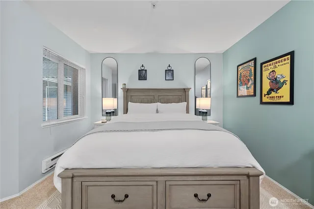 a bedroom with a bed and a window