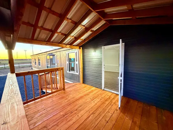 a view of porch with wooden floor