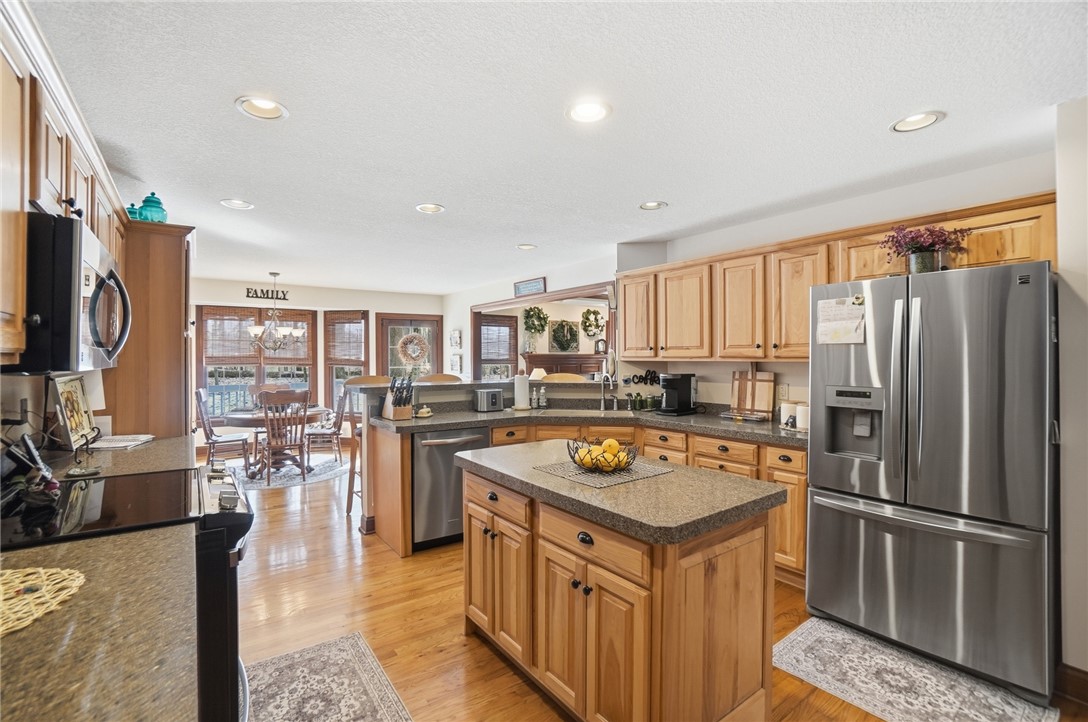 5300 Brookshire Lane Springfield, OH 45502 - Photo 19 of 56 This spacious kitchen offers a central island, modern appliances, and a seamless flow into the dining area.