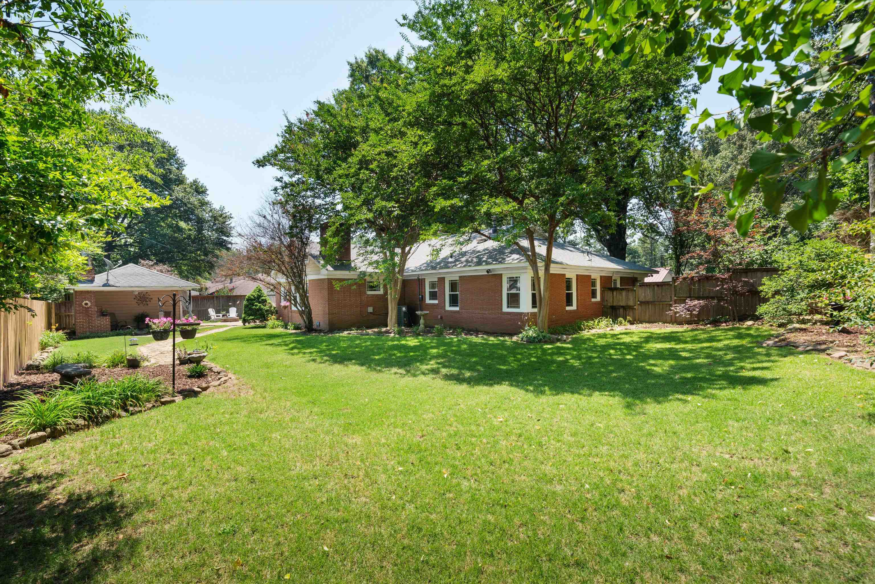 3374 Walnut Grove Road Memphis, TN 38111 - Photo 20 of 25 a front view of a house with garden