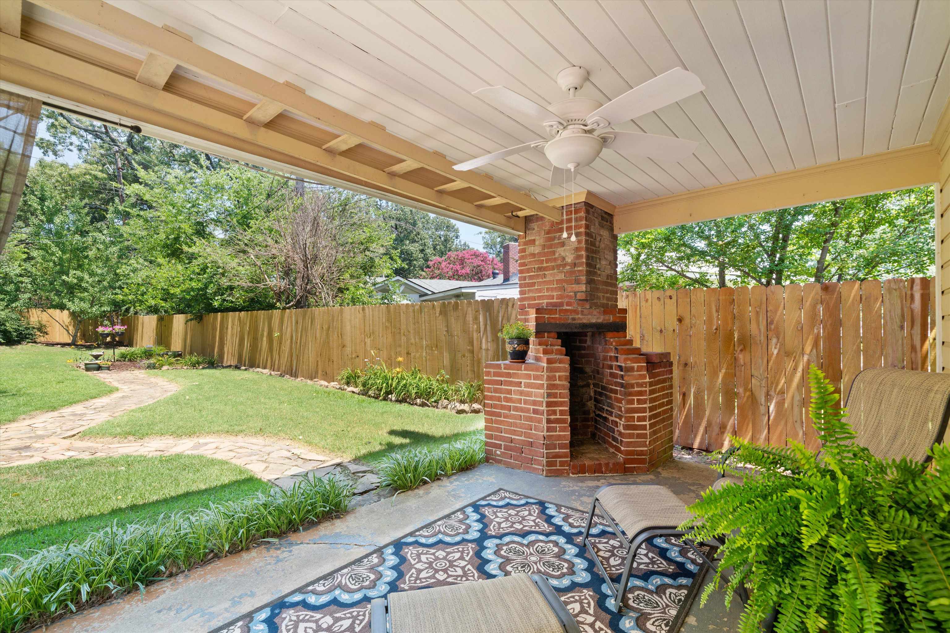 3374 Walnut Grove Road Memphis, TN 38111 - Photo 23 of 25 a backyard of a house with a garden and deck