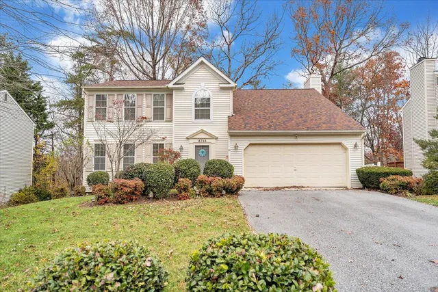 a front view of a house with a garage