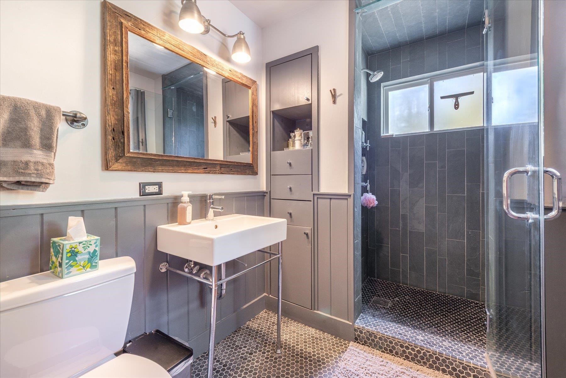 625 High Street Carnelian Bay, CA 96140 - Photo 12 of 22 a bathroom with a tub sink and mirror