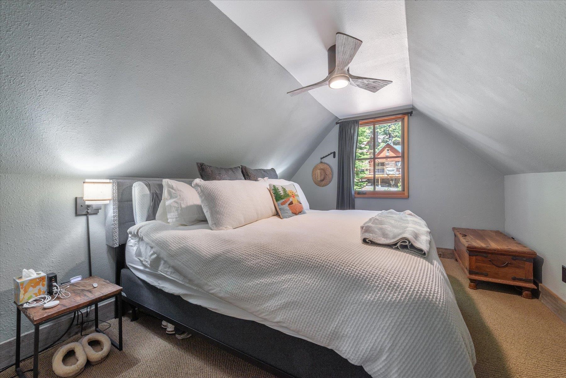 625 High Street Carnelian Bay, CA 96140 - Photo 14 of 22 a bedroom with a bed and a window