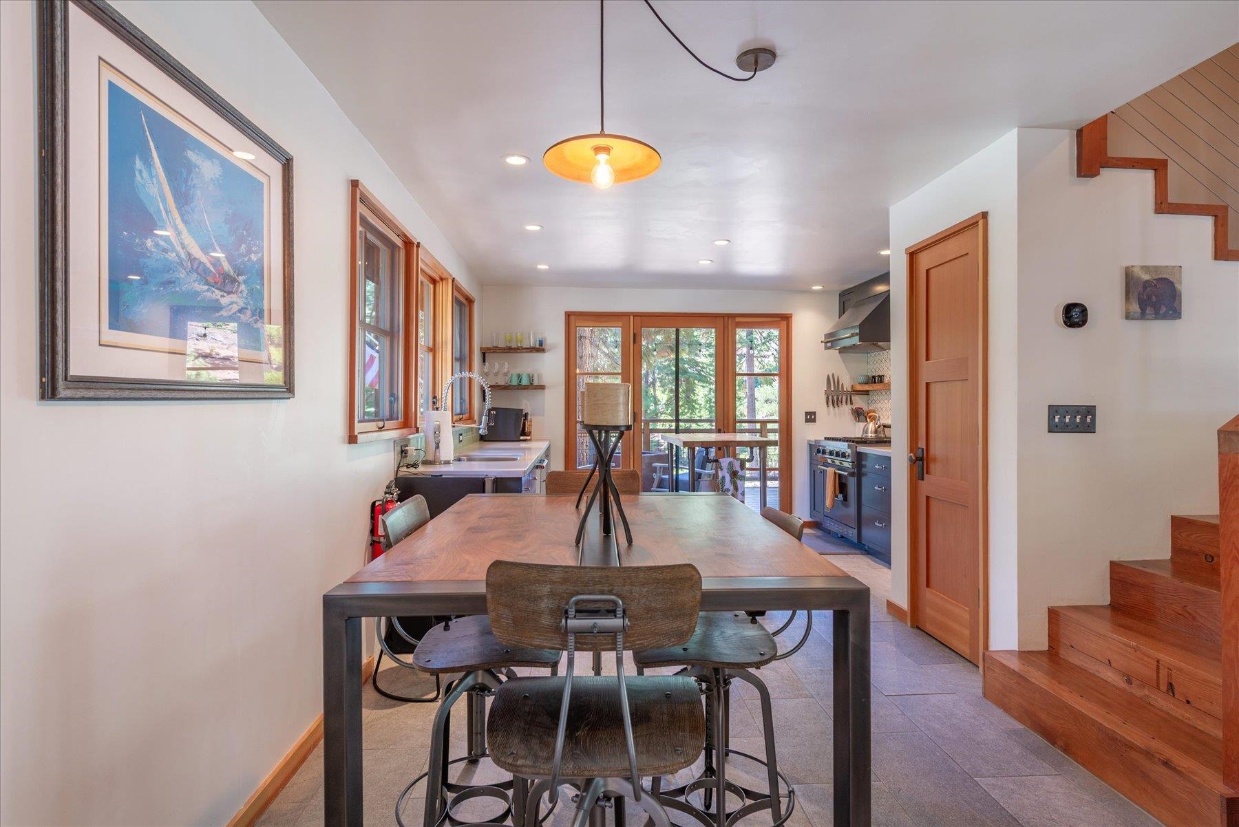 625 High Street Carnelian Bay, CA 96140 - Photo 8 of 22 a view of a dining room with furniture and wooden floor