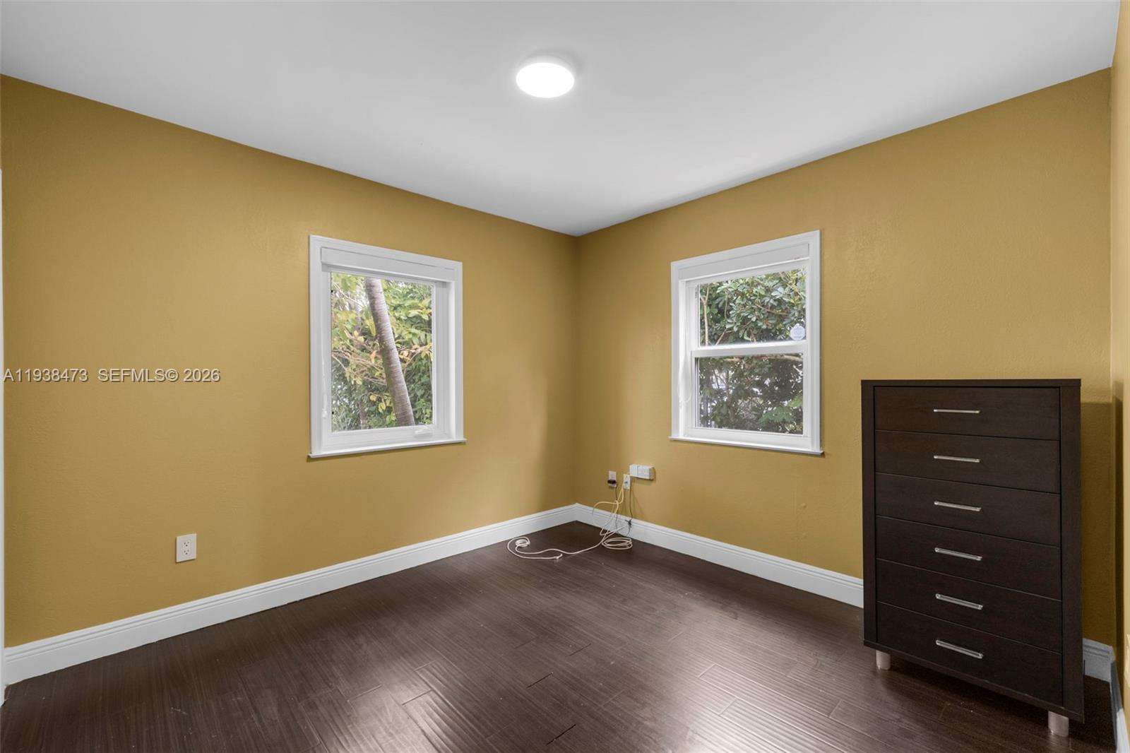 6086 Southwest 20th Street Miami, FL 33155 - Photo 19 of 35 a view of a room with wooden floor and window