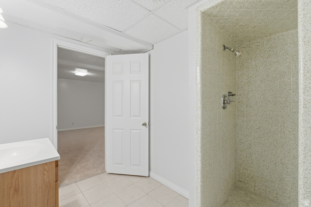 148 Tennyson Avenue Sandy, UT 84070 - Photo 34 of 55 Tiled shower stall with a chrome showerhead and control