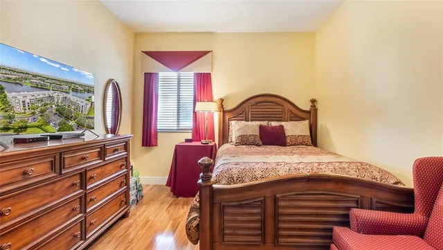 a bathroom with a sink a toilet a mirror and shower