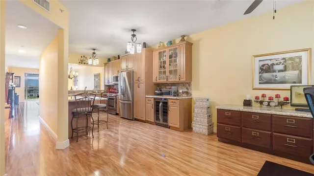 a view of living room with furniture and wooden floor