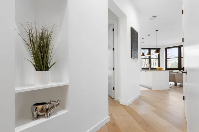 a bathroom with a granite countertop sink mirror and toilet