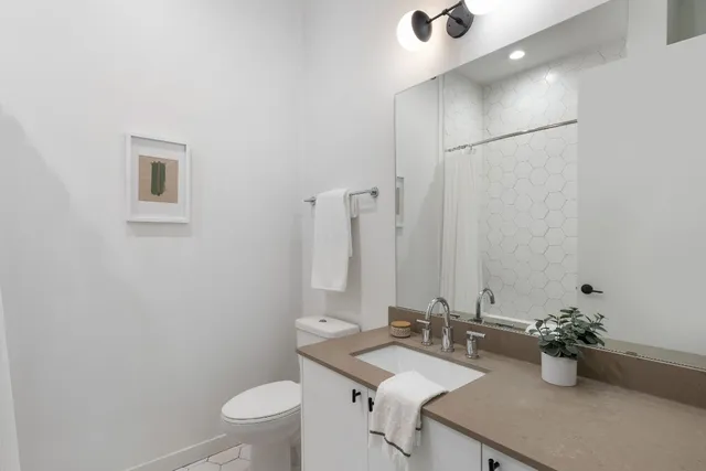 a bathroom with a white bathtub and a shower