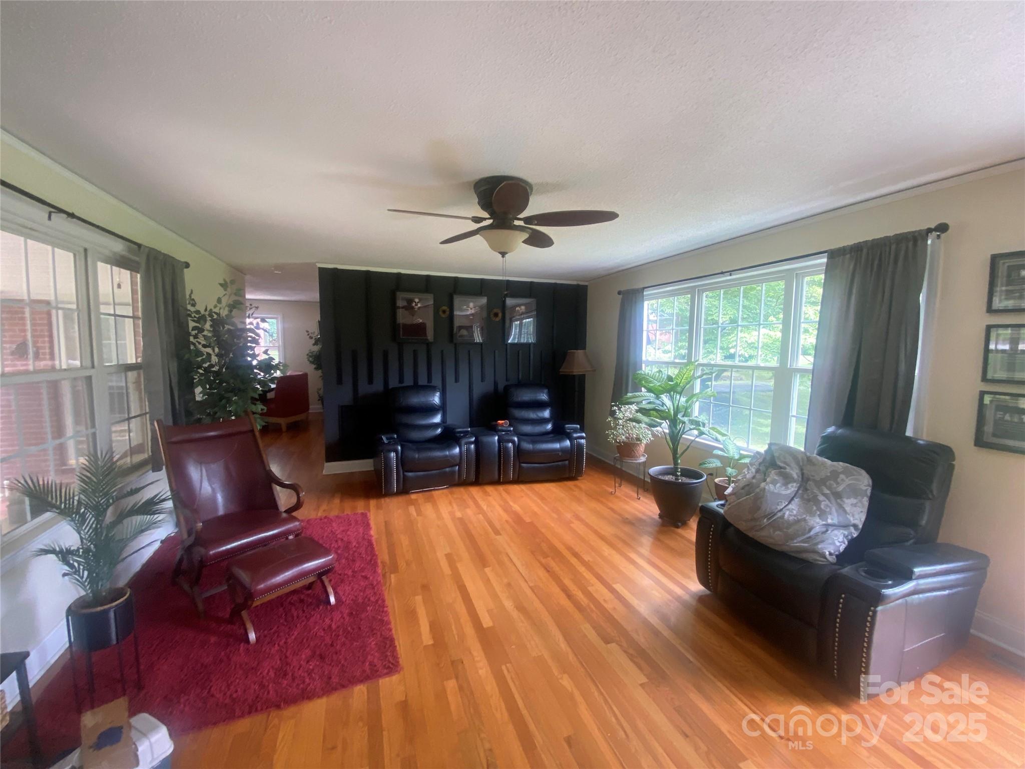 704 Marion Sims Drive Lancaster, SC 29720 - Photo 3 of 7 a living room with furniture and a large window